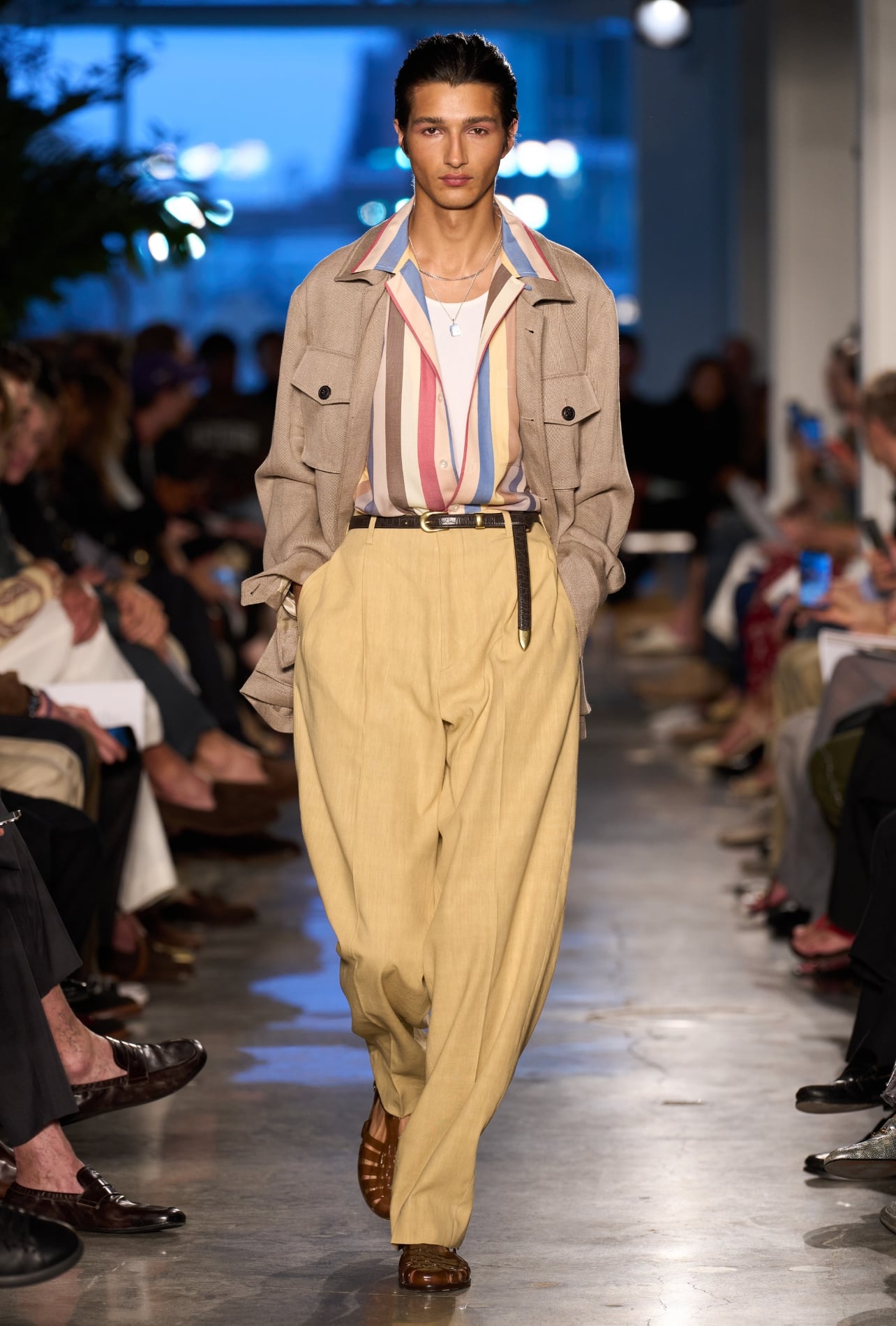 Todd Snyder runway model wearing a colorful striped button up and yellow pants