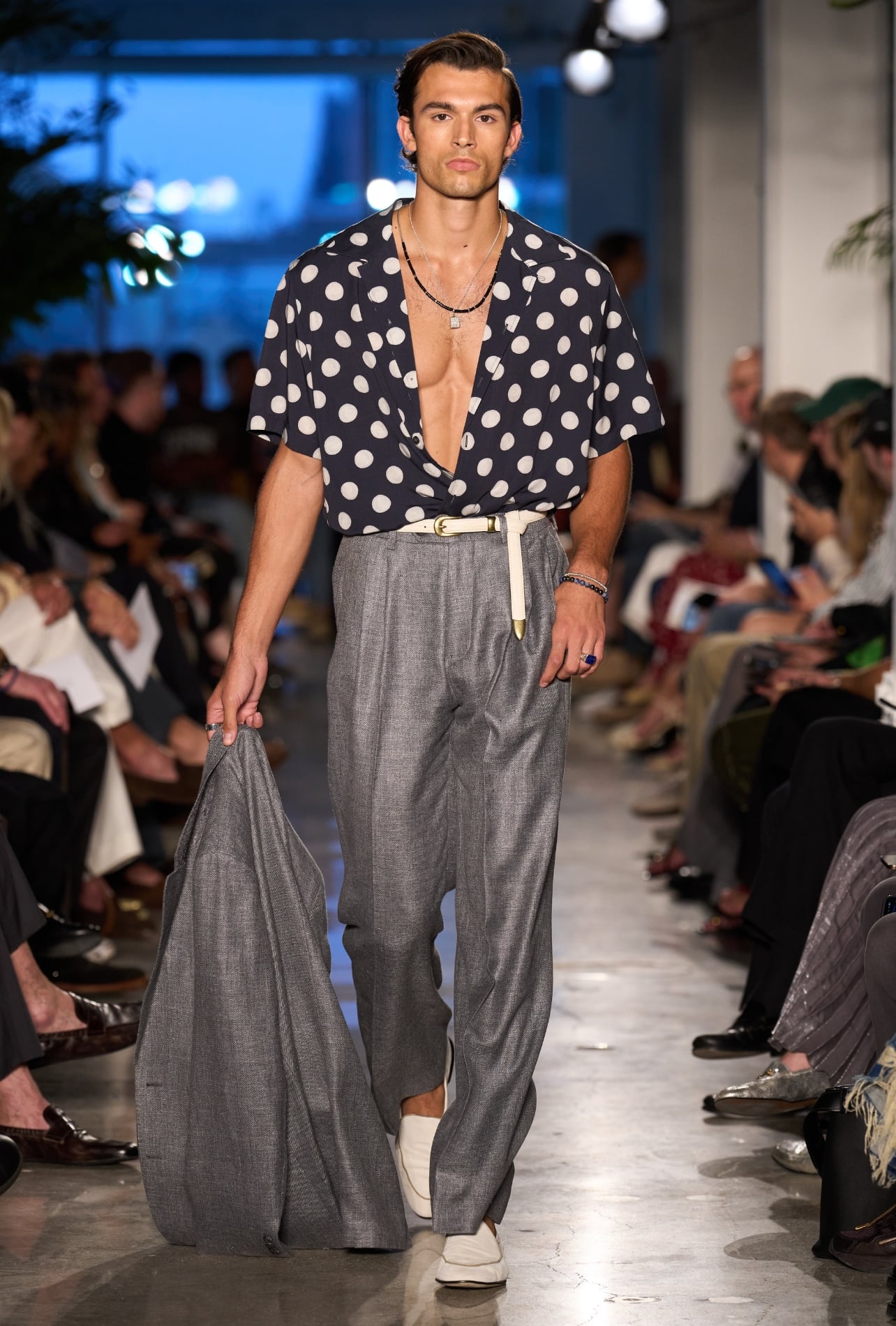 Todd Snyder runway model wearing polka dot shirt and grey suit