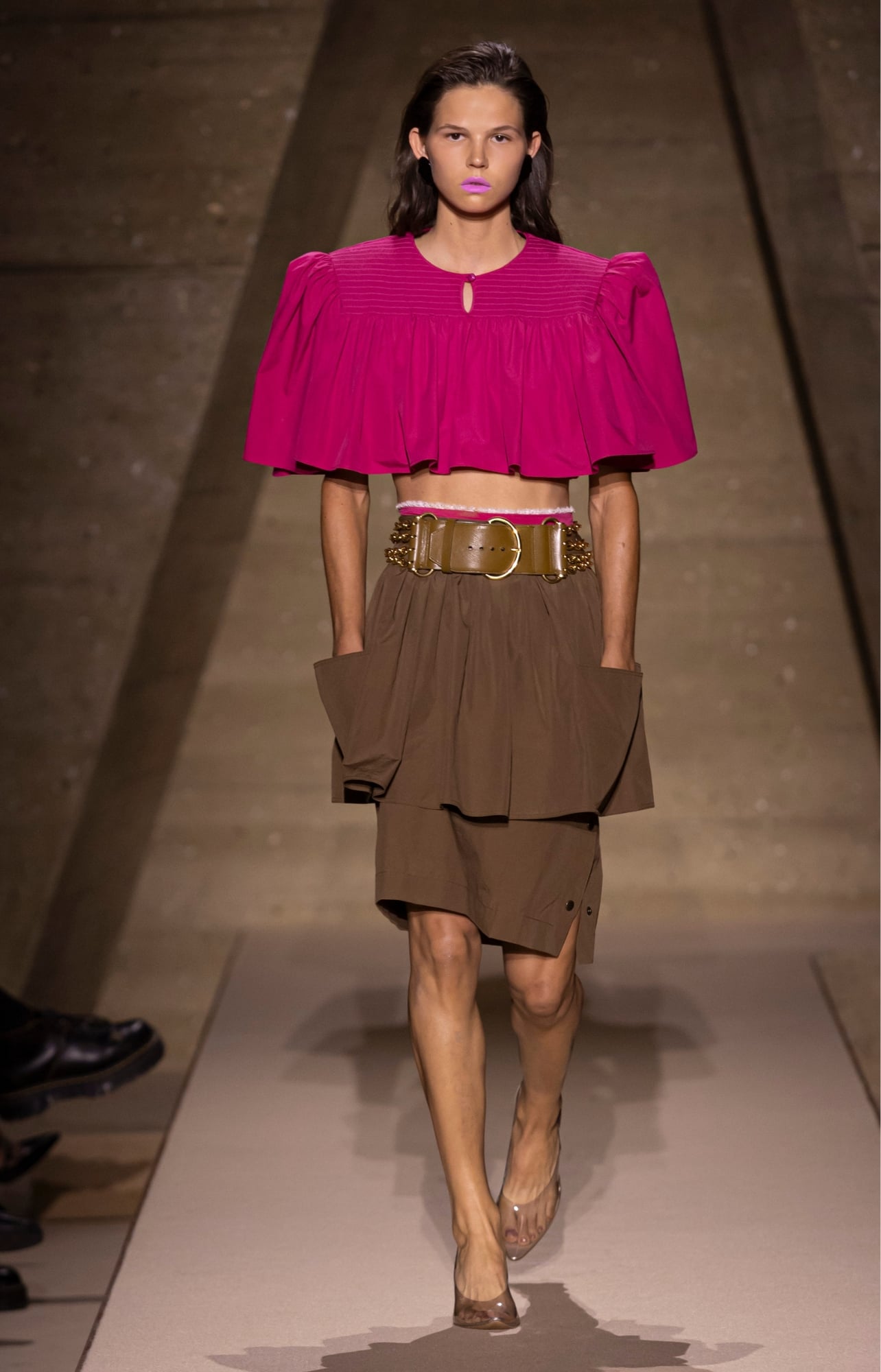 Chloé runway model wearing a pink top and brown pants
