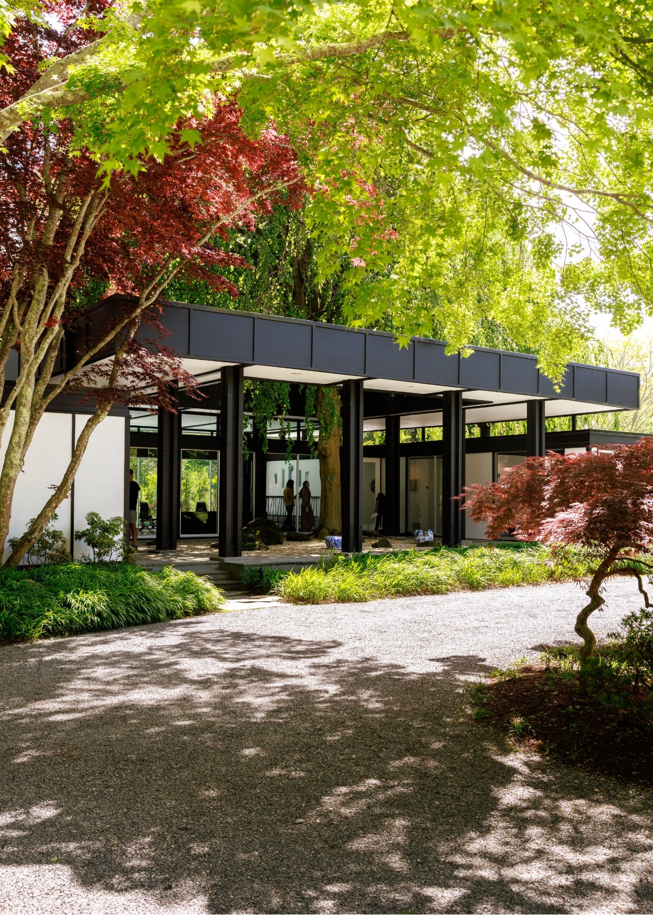 Exterior shot of the Onna House gallery in East Hampton surrounded by trees