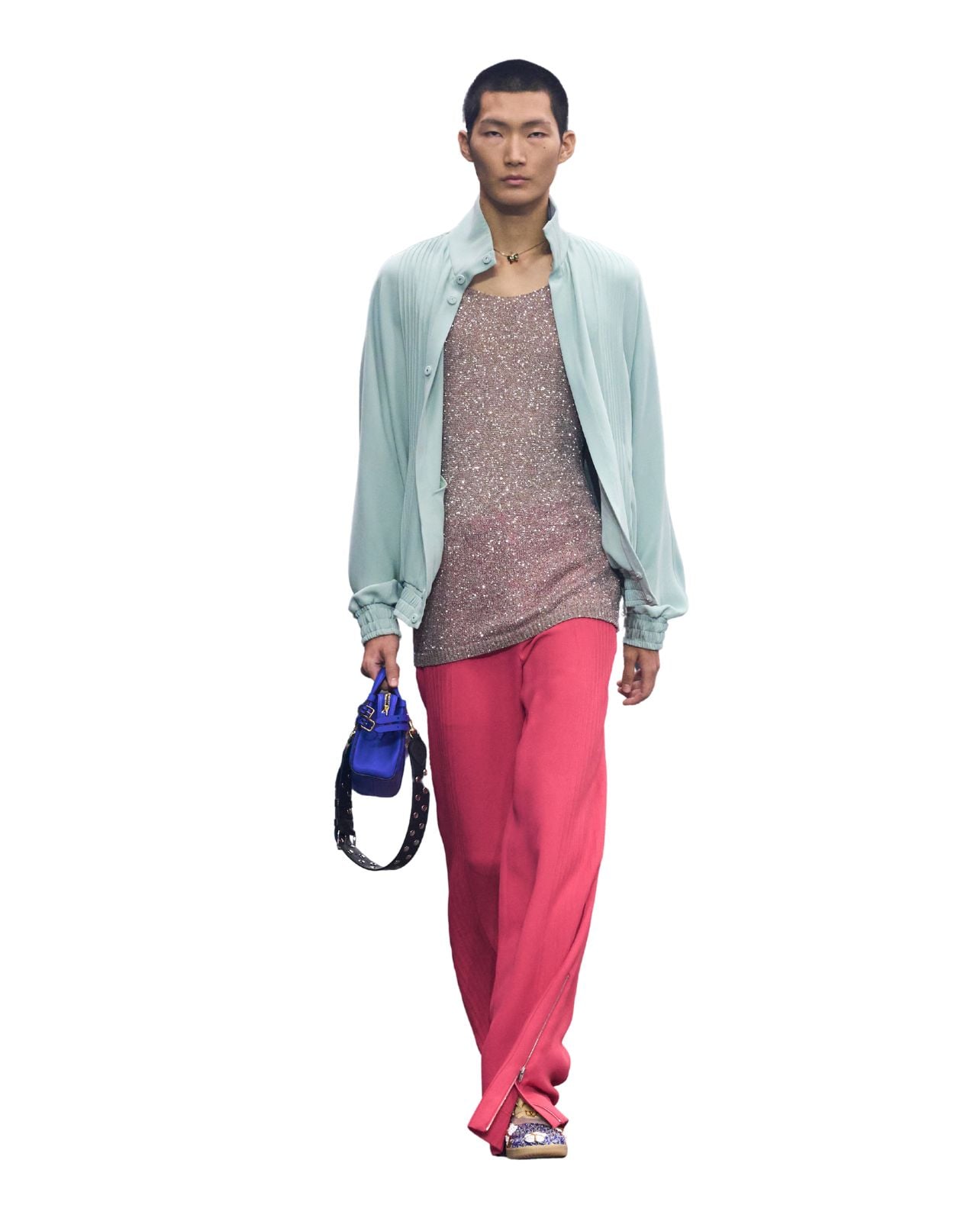 Valentino runway model wearing pink pants and a blue top