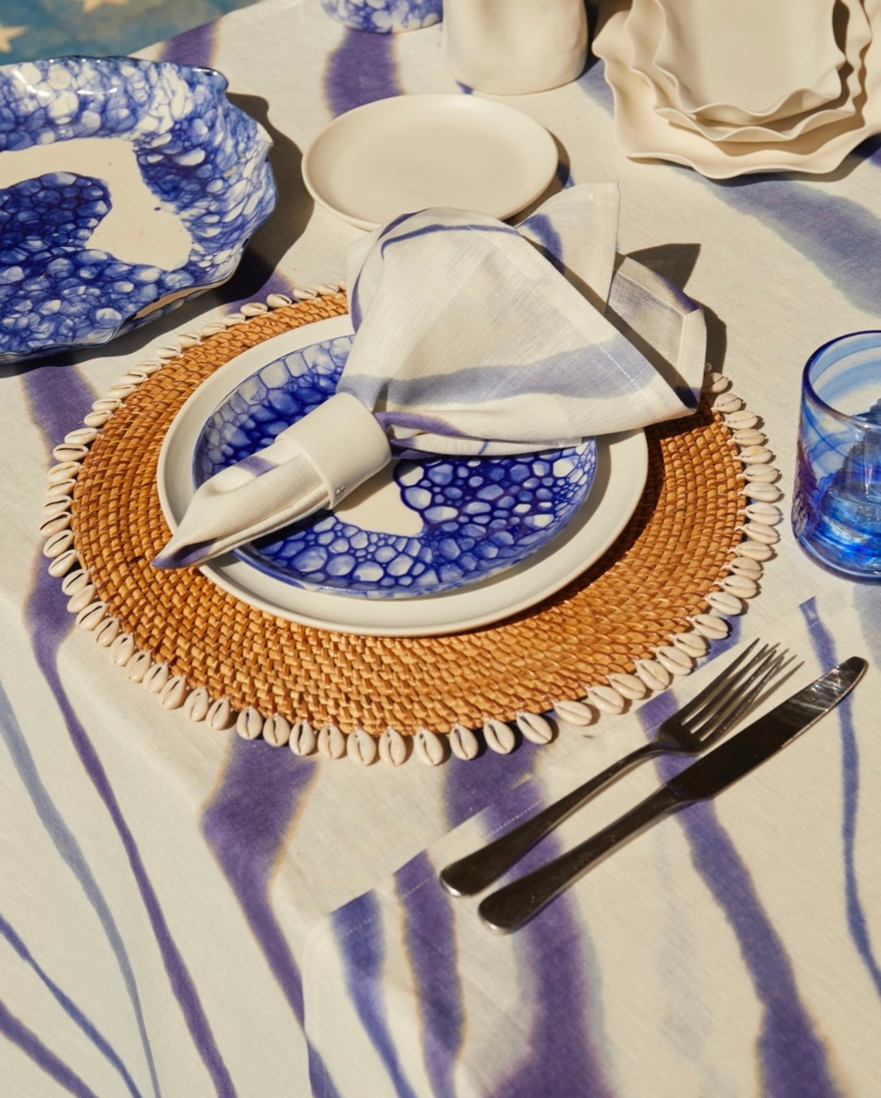 A tablescape with a plate and a napkin featuring DB Ceramics Cobalt Blue collection