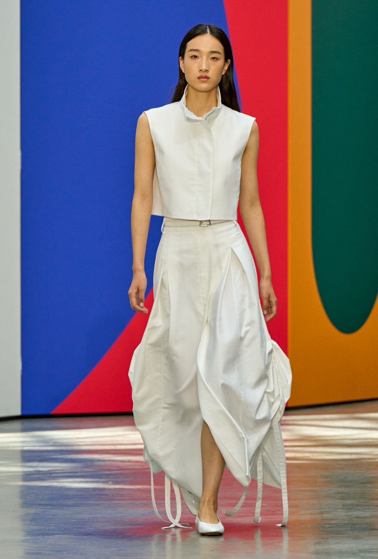 Akris runway model wearing a white skirt and top