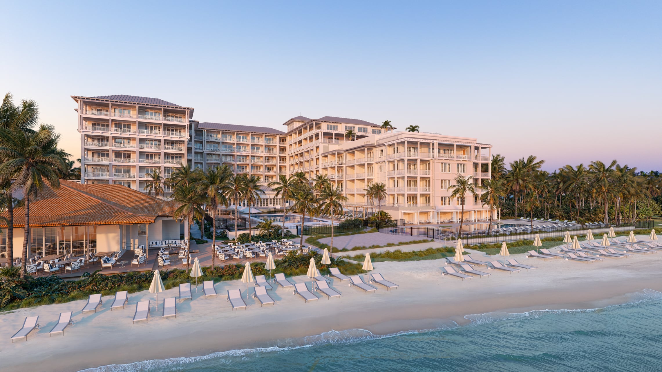Exterior view of Four Seasons Naples resort at sunset