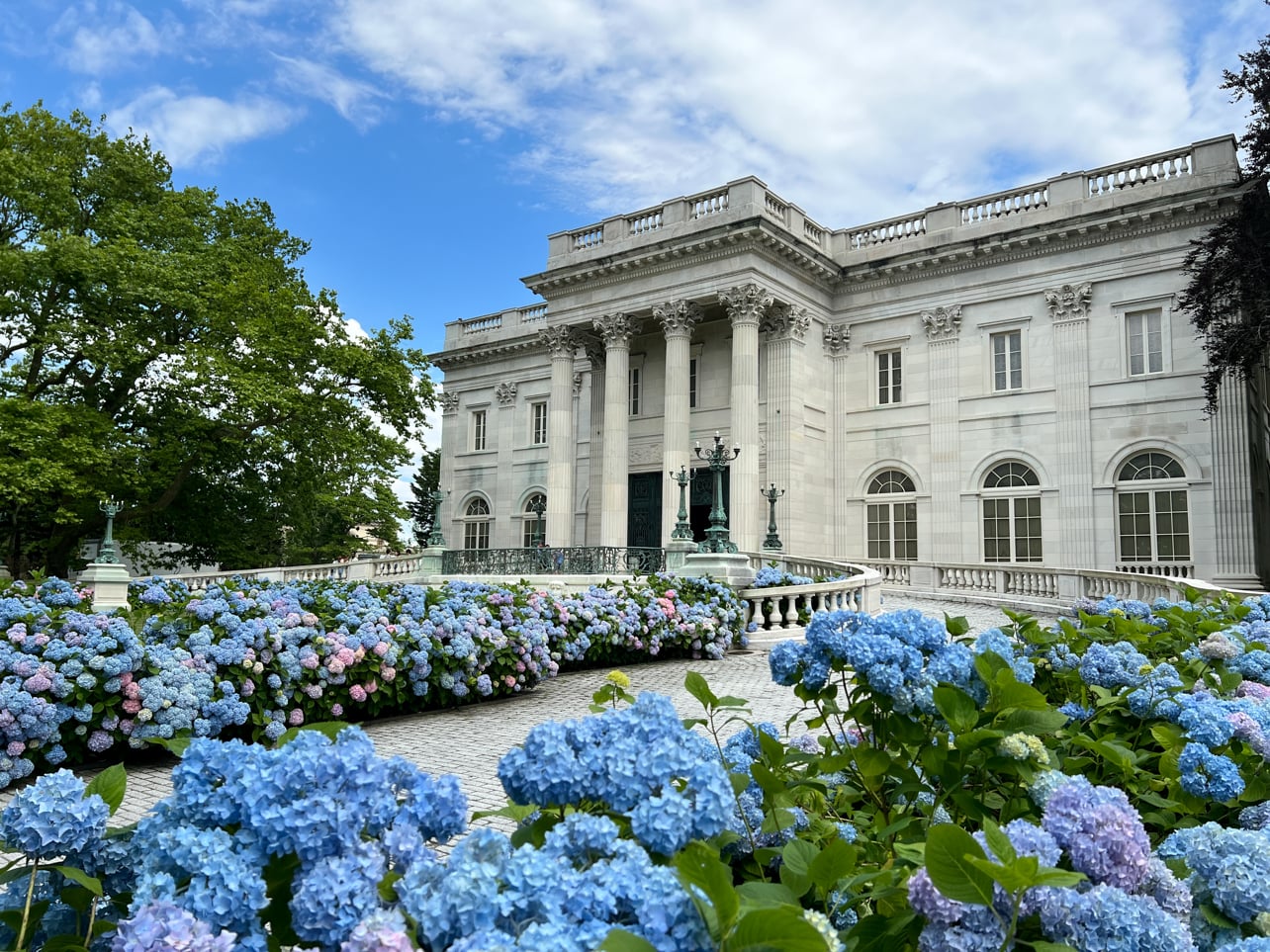 Newport Marble House framed by blooming hydrangeas