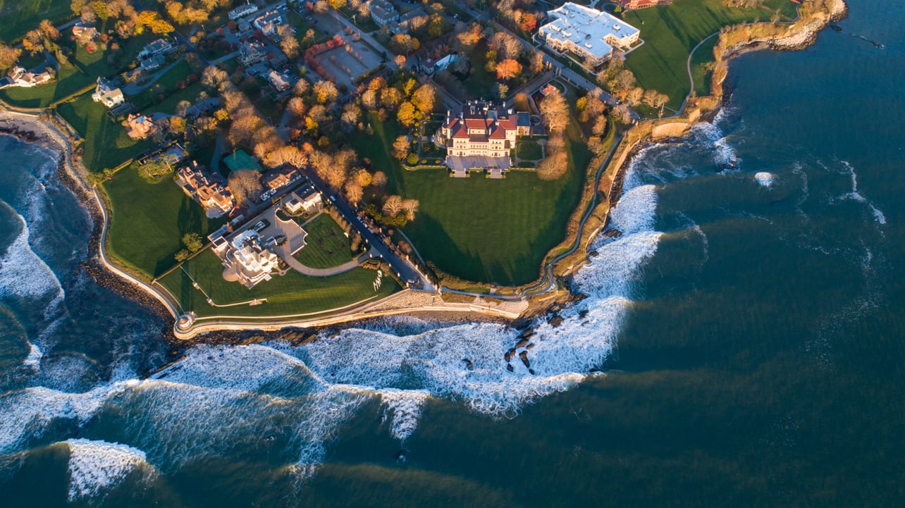 Newport Cliff Walk from above with waves crashing against the rocky shoreline