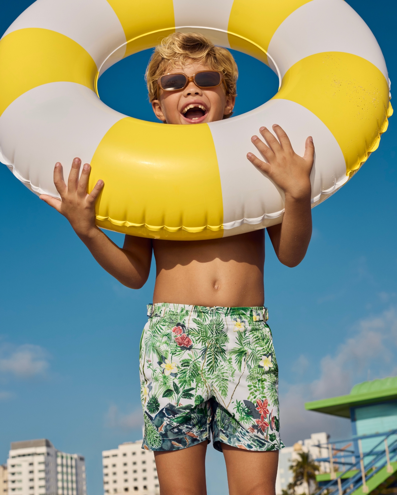 child holding beach ring