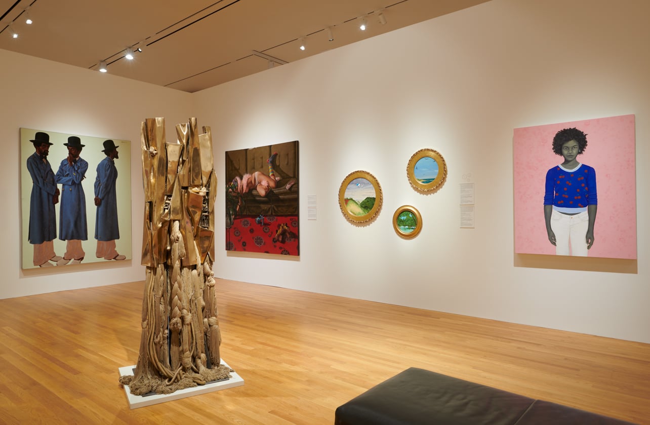 Gallery interior featuring a gold sculpture and assorted artworks on display at the Nasher Museum