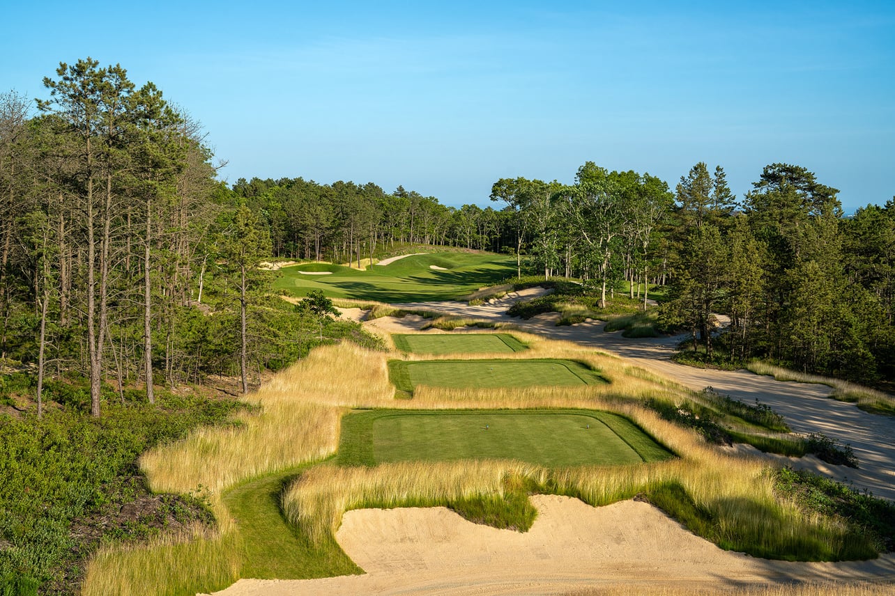 Golf course surrounded by tall grass at The Hills