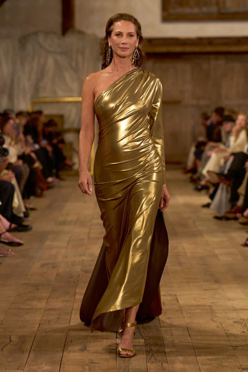 Ralph Lauren Spring 2024 runway look featuring a gold dress worn by Christy Turlington