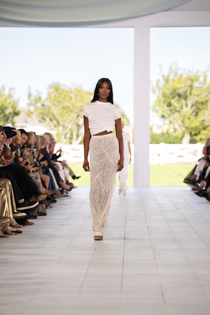 Ralph Lauren Spring 2025 runway look featuring a white top and skirt worn by Naomi Campbell
