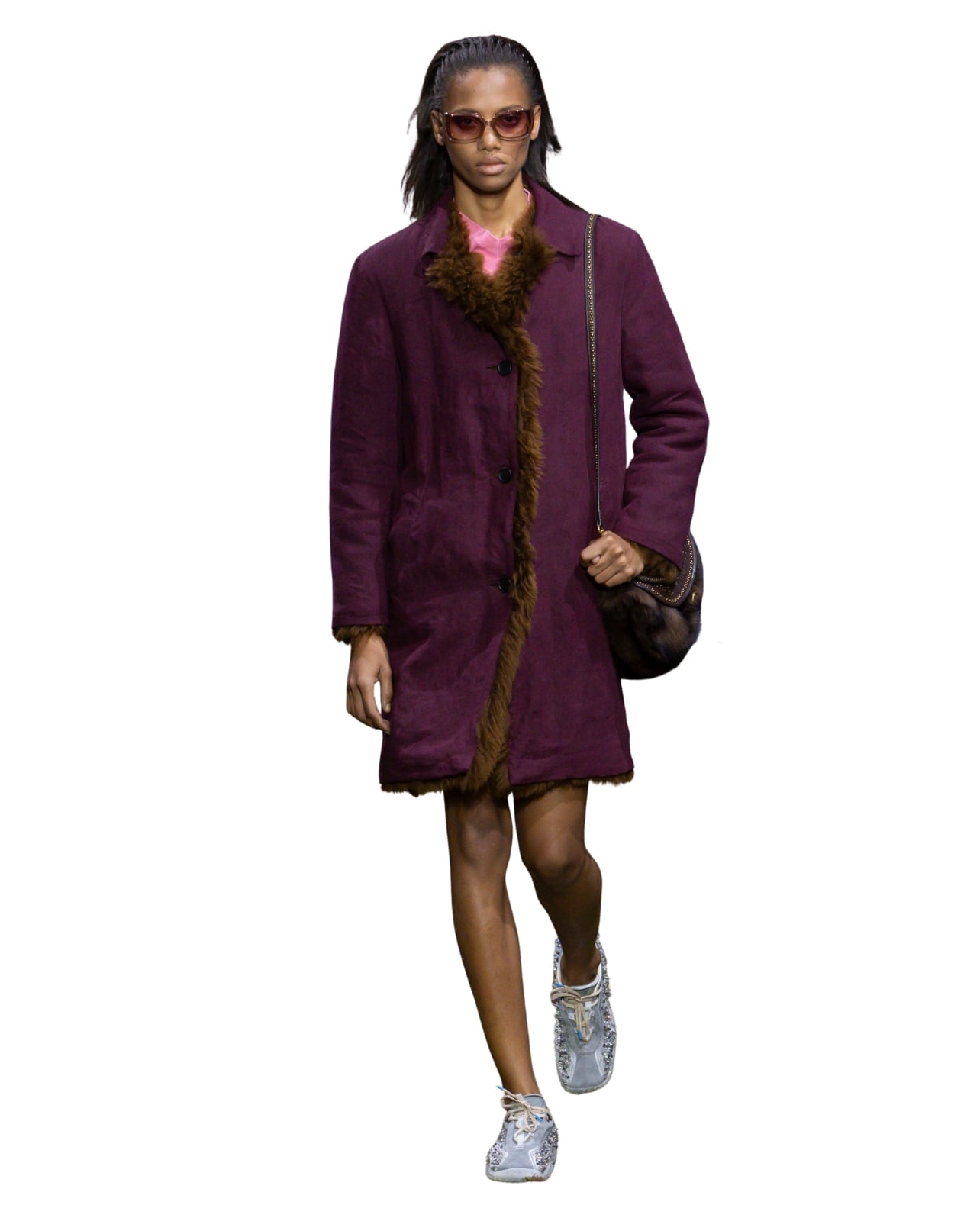 Miu Miu runway model wearing a maroon and fur jacket for Fall/Winter