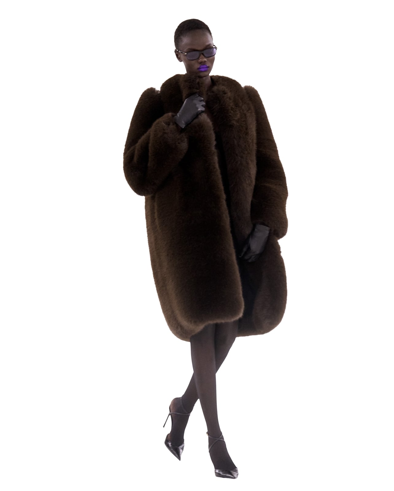 Tom Ford runway model wearing a brown fur jacket for Fall/Winter