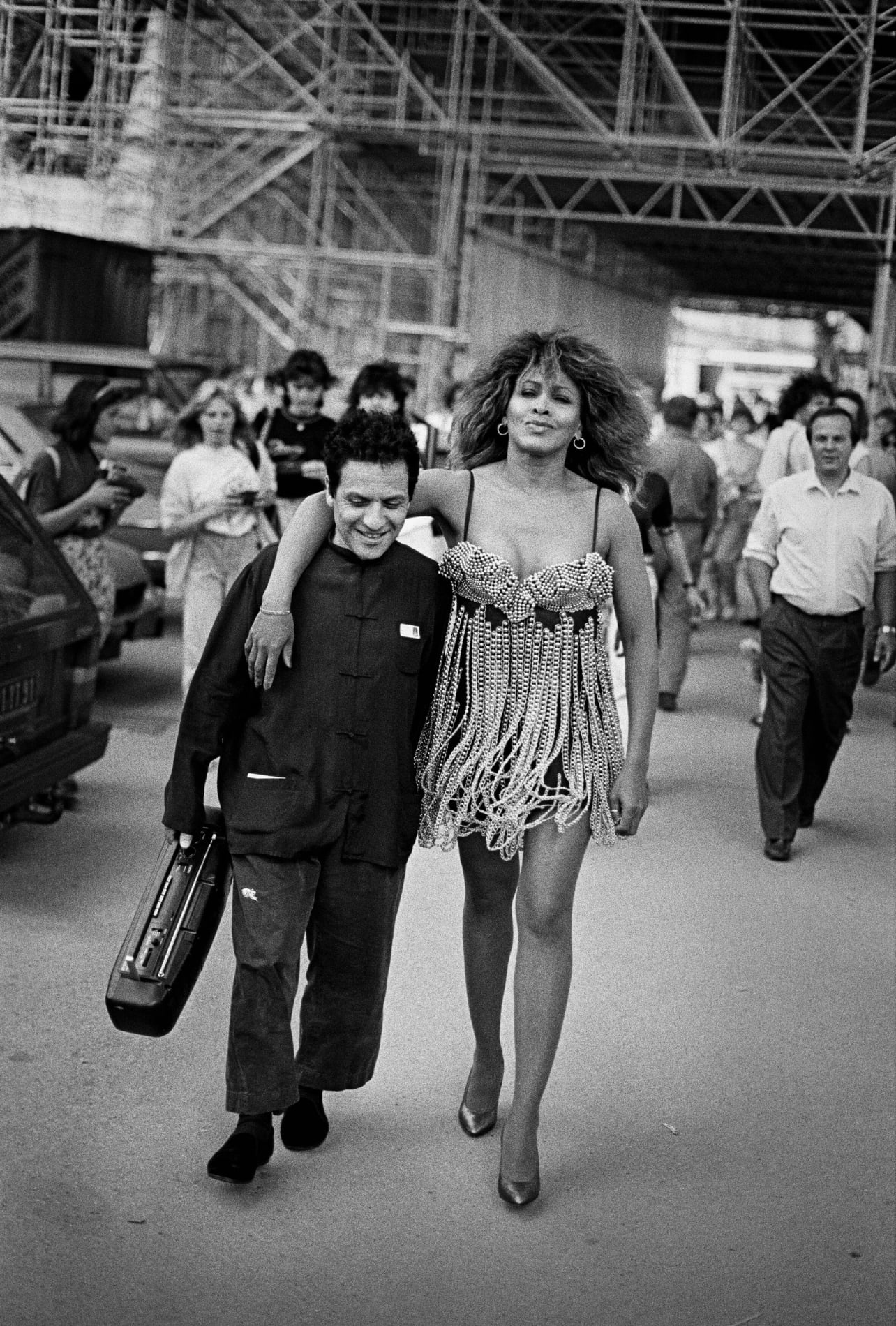 A black and white photograph of Azzedine Alaïa and Tina Turner