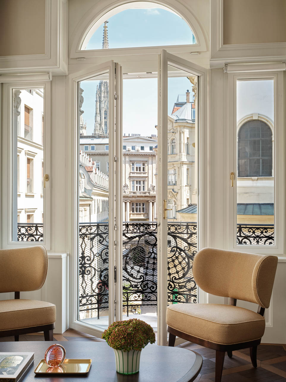 Interior of a hotel living room with a balcony at Hoffmann House