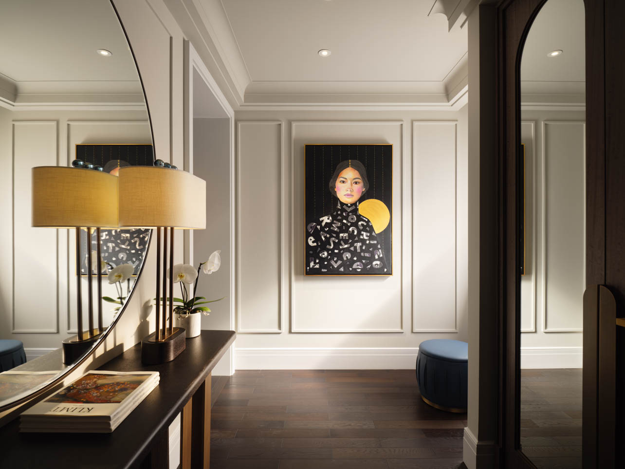 A Premier Suite at the Mandarin Oriental with a painting of a woman on the wall
